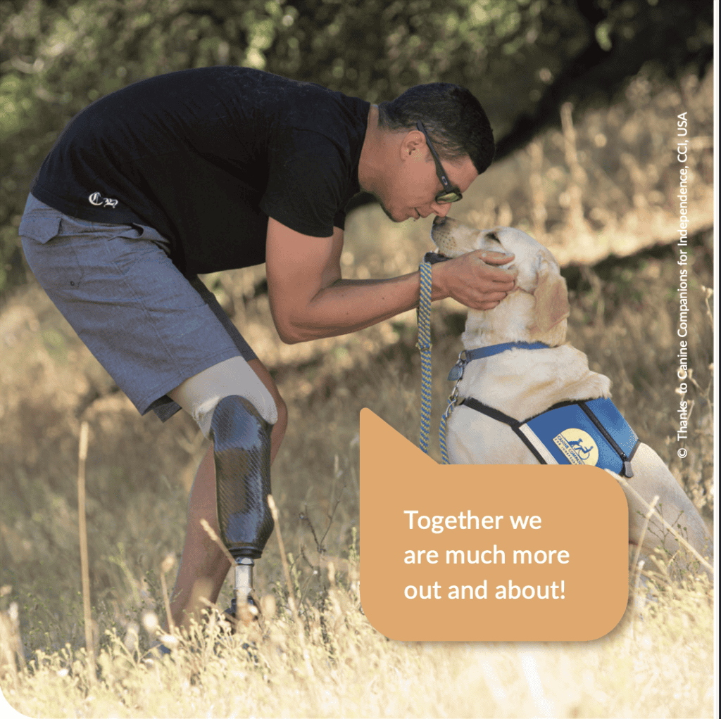 Prosthetic limb and assistance dog helping a man outdoors, symbolizing support and mobility.